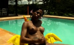 Tatooed ebony tgirl plays with good sized shemeat by pool