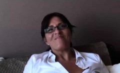 Attractive busty MILF Amber playing with herself on the sofa