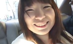 Busty asian having fun in a car