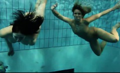 Two sexy amateurs showing their bodies off under water