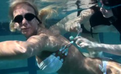 Retro footage of two underwater lesbians