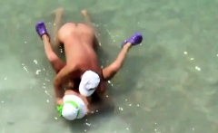 Mature couple sex in the sea