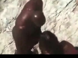 Big black dude fucking his white girlfriend at the beach