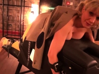 Lady Sonia caged and strips nude in the sex dungeon