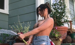 Nude latina muse watering her flowers