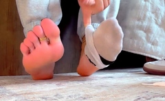 Brunette with foot fetish rubs big dick with her feet in POV