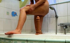 Redhead babe cums with her favorite toy after a shower.